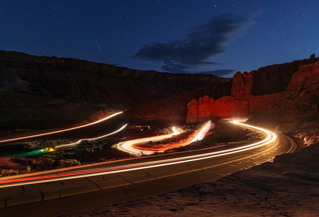 (Leah Hogsten | The Salt Lake Tribune)  A stream of vehicles travels up and down the winding road near the entrance to Arches National Park, Monday, May 15, 2023.