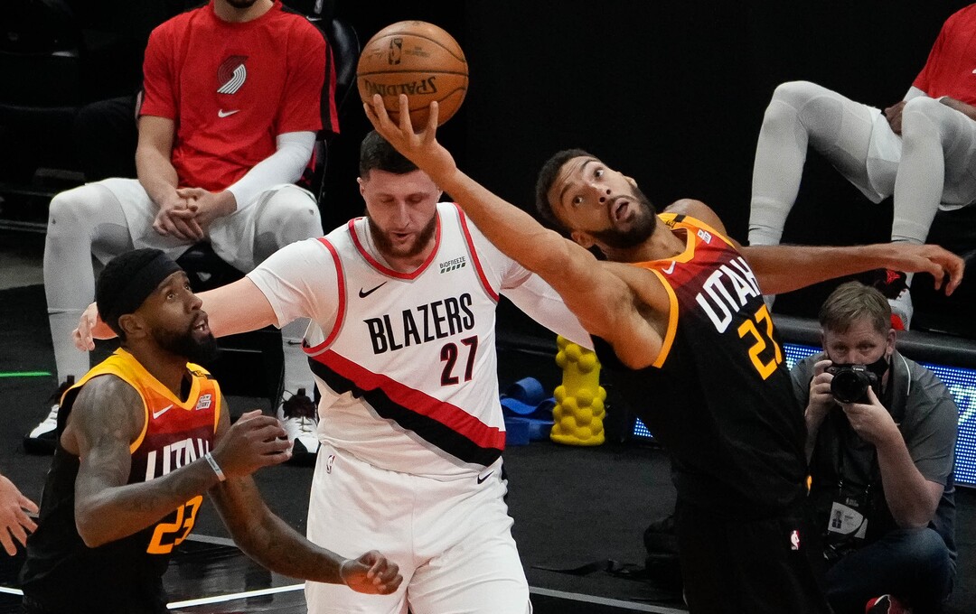 (Francisco Kjolseth | The Salt Lake Tribune) Utah Jazz center Rudy Gobert (27) stretches out for a rebound in NBA action between the Utah Jazz and the Portland Trail Blazers, at Vivint Smart Home Arena, on Wednesday, May 12, 2021.