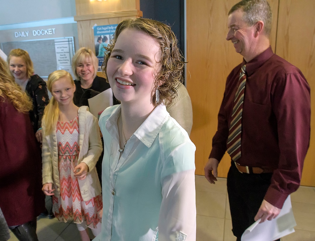 (Eli Lucero  |  Pool Photo)  Deserae Turner smiles outside the courtroom surrounded by her family, following Jayzon Decker's sentencing hearing for attempted aggravated murder and obstructing justice, Wednesday, Feb. 7, 2018, in Logan, Utah. Decker received a sentence of 15 years to life for planning and being present at the shooting of Deserae Turner in February 2017, and leaving her for dead in a dry irrigation canal in Smithfield, Utah.