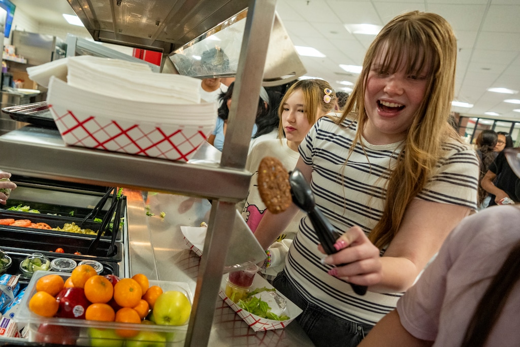 (Rick Egan | The Salt Lake Tribune)  Neko Mabe grabs a cookie during lunch at Bryant Middle School, on Tuesday, April 14, 2026. The Salt Lake City School District is considering raising the prices of school meals this fall.
