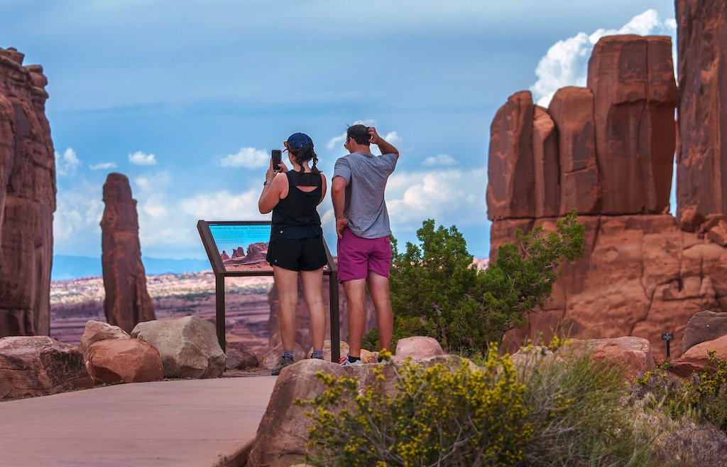 (Leah Hogsten | The Salt Lake Tribune)  Visitors stop at the Park Avenue overlook in Arches National Park, Monday, May 15, 2023. 