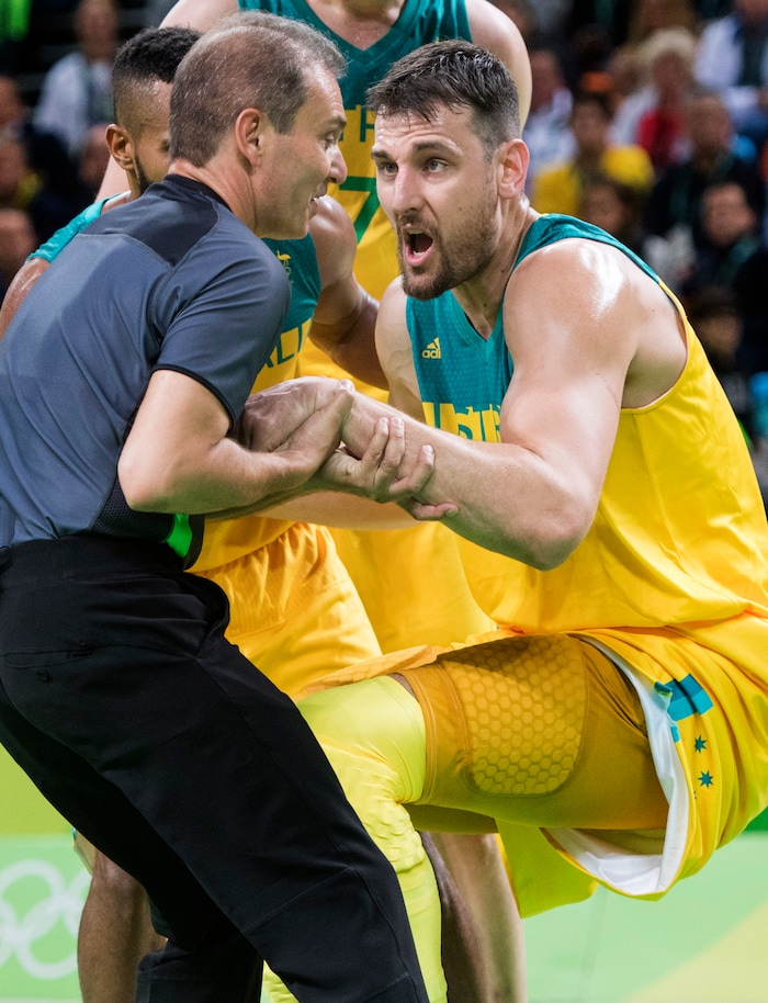 Rick Egan  |  The Salt Lake Tribune
Andrew Bogut (6) of Australia, has a few words for three official, as he helps him to his feet, after being knocked to the ground by Kevin Durant (5) of United States, in Olympic basketball action, USA vs. Australia,  in Rio de Janeiro, Wednesday, August 10, 2016.
