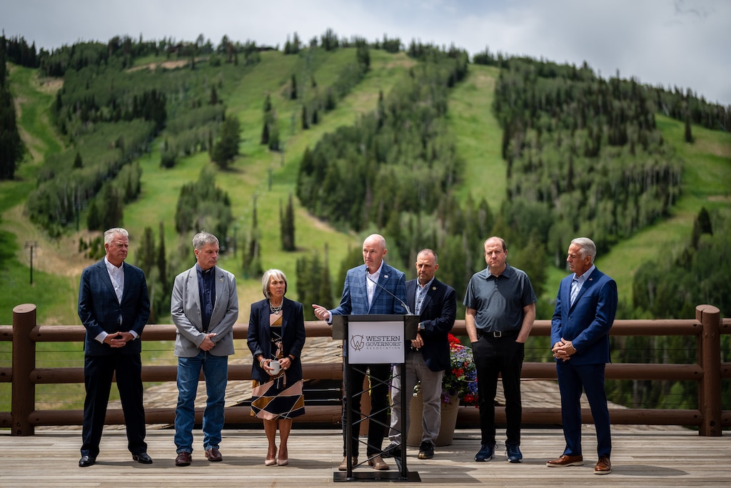 (Trent Nelson  |  The Salt Lake Tribune) Gov. Spencer Cox speaks during a news conference at the annual meeting of the Western Governors' Association in Park City on Tuesday, June 30, 2026. From left are Gov. Brad Little, ID, Gov. Mark Gordon, WY, Gov. Michelle Lujan Grisham, NM, Cox, Gov. Josh Green, HI, Gov. Jared Polis, CO, and Gov. Joe Lombardo, NV.