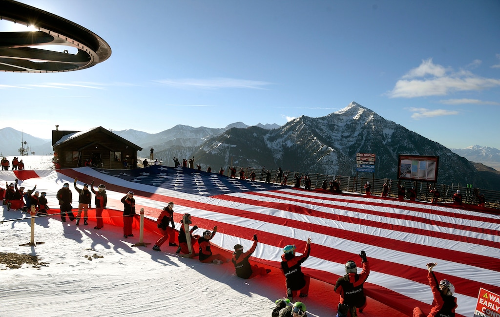 (Al Hartmann | The Salt Lake Tribune)
Bearclaw Cabin at Sundance Mountain Resort is the backdrop to a Follow the Flag event. The resort plans to build a new lift for the 2025-26 season that will take skiers and snowboarders to the cabin from the southeast side of the ski area. The Electric Horseman Express will start near the Wildwood lift and open up 165 acres of terrain by 2026-27.