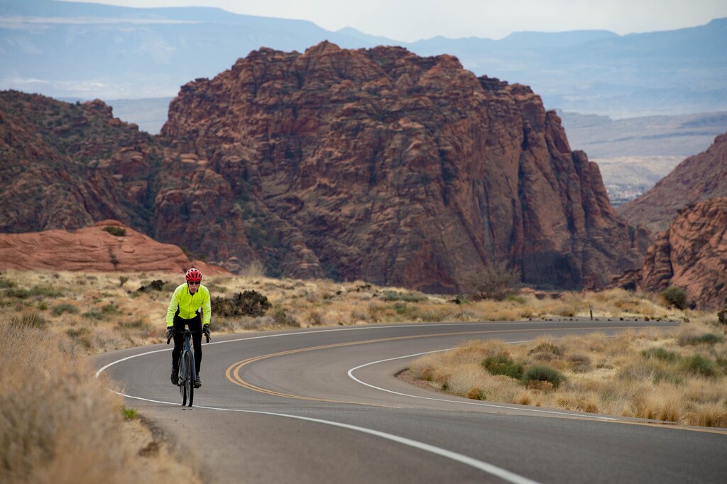 (Francisco Kjolseth  | The Salt Lake Tribune) A cyclist nears the top of Snow Canyon State Park, surrounded by towering sandstone cliffs and ancient lava flows. 
