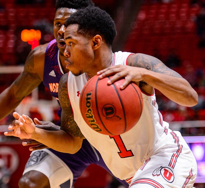 (Trent Nelson | The Salt Lake Tribune)  Utah Utes guard Justin Bibbins (1) drives on Northwestern State Demons forward Brandon Hutton (34) as the University of Utah hosts Northwestern State, NCAA basketball in Salt Lake City, Wednesday December 20, 2017.