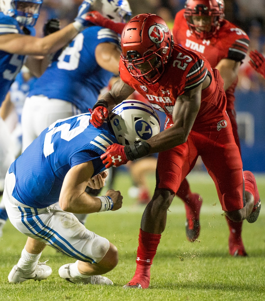 (Rick Egan  |  The Salt Lake Tribune) Utah Utes defensive back Casey Hughes (25) sacks Brigham Young Cougars quarterback Tanner Mangum (12), in football action BYU vs Utah, at Lavell Edwards Stadium in Provo, Saturday, September 9, 2017.