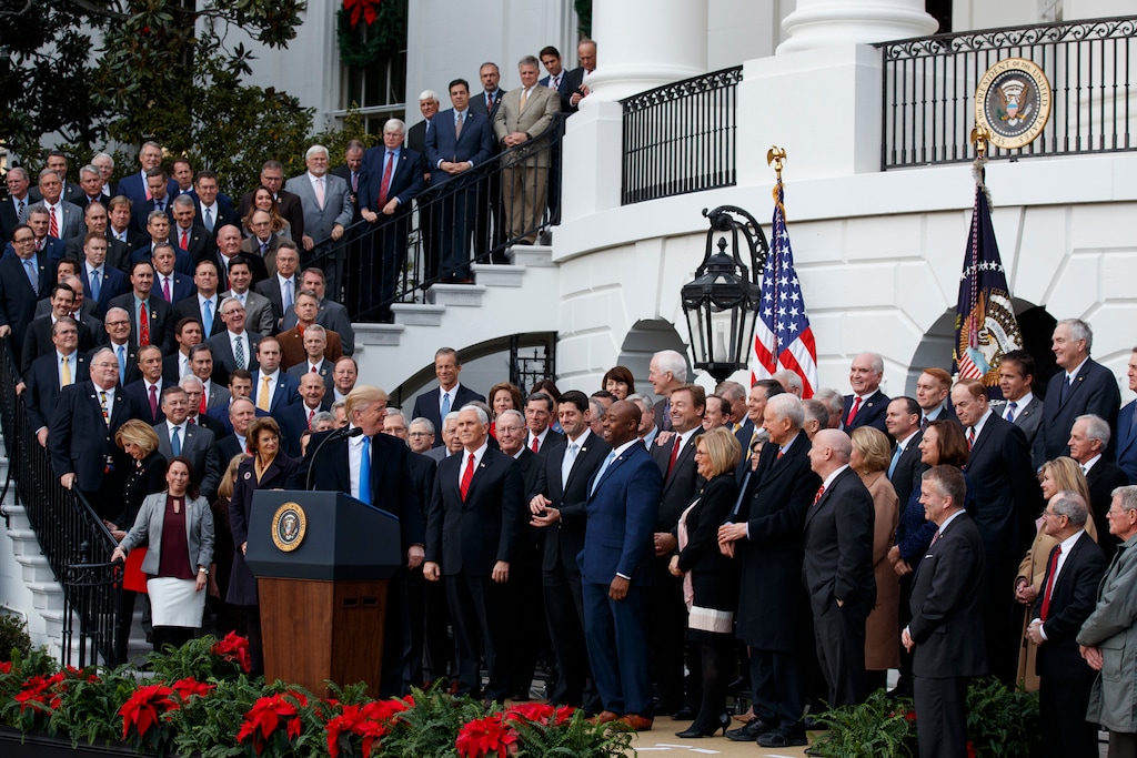 (Evan Vucci | AP Photo) In this Dec. 20, 2017 file photo, President Donald Trump speaks during an event on the South Lawn of the White House in Washington, to acknowledge the final passage of tax overhaul legislation by Congress. Perhaps nowhere is the choice facing voters more vivid than in the battle for control of the House, where Democrats are fielding more women and female minority candidates than ever while Republicans are trying to hold the majority with mostly white men. The disparity highlights a trend that has been amplified under President Donald Trump, with the two parties increasingly polarized along racial and gender lines as much as by the issues.