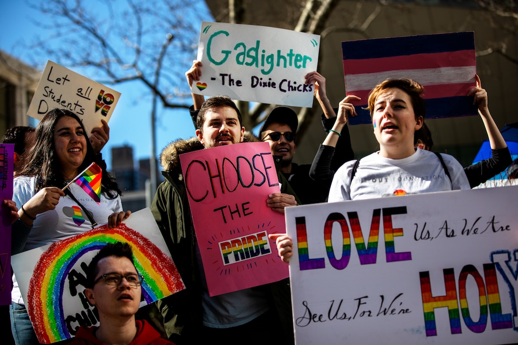 (Demetrius Freeman | Special to The Tribune) Current and former members of The Church of Jesus Christ of Latter-day Saints, the LGBTQ+ community, and supporters protest at Lincoln Square across from the Latter-day Saints temple in Manhattan on Saturday, March 7, 2020. BYU reinstated policies in its student handbook that prohibit "homosexual behavior."