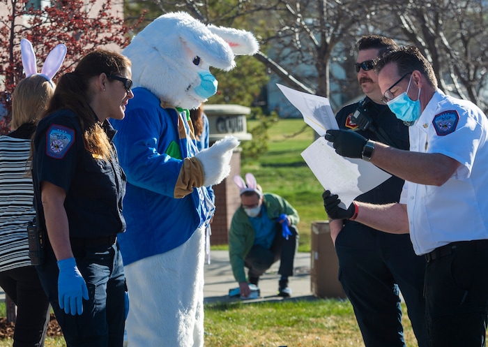 (Rick Egan  |  The Salt Lake Tribune)     Members of the Draper City Parks and Recreation, along with the police and the fire department, prepare to deliver more than 30,000 Easter Eggs to children at their doorstep in Draper, Friday, April 10.
