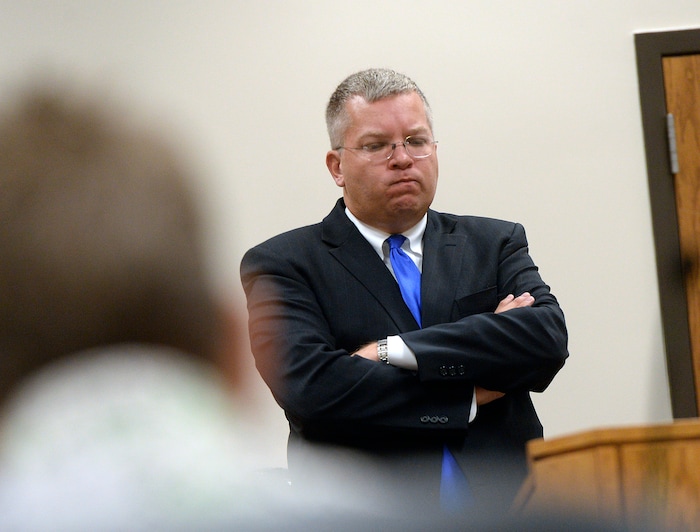 (Al Hartmann  |  The Salt Lake Tribune) 	Deputy Utah County Attorney Craig Johnson listens to recorded phone call by Provo Police between defendent Nasiru Seidu and a BYU student in Provo Tuesday Oct. 10.  Seidu is accused of raping a BYU student at her off-campus apartment two years ago.  