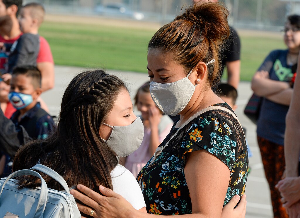 (Chris Samuels | The Salt Lake Tribune) Parents say goodbye to students as they begin the first day of school at Whittier Elementary in West Valley City, Monday, Aug. 16, 2021. Doctors are now trying to combat myths they say are leading some families to not send their kids back masked up.