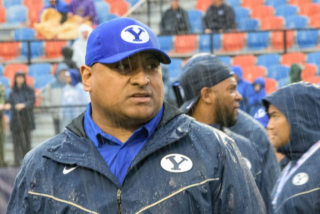(Matthew Hinton | AP) BYU head coach Kalani Sitake walks the field after a weather delay for Independence Bowl NCAA college football game against UAB in Shreveport, La., Saturday.