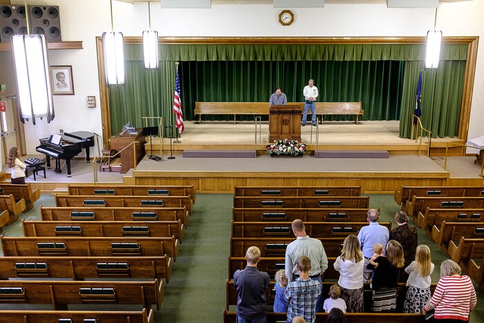 (Trent Nelson | The Salt Lake Tribune)  Duane Jessop gives the opening prayer during a Sacrament Meeting of the Second Ward in Pinesdale, Mont. While AUB churchgoers would have filled the chapel a few years ago, the members are now no longer attending services, or split into factions, leaving many pews empty during Sunday services.