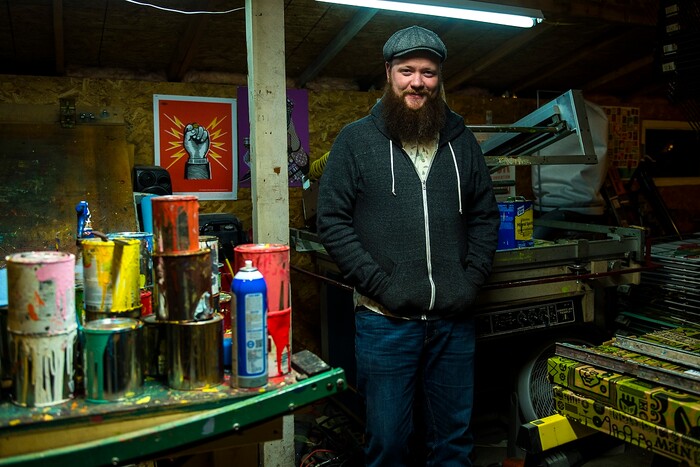(Chris Detrick | The Salt Lake Tribune) Artist Travis Bone poses for a portrait in his workshop in Midvale Tuesday, November 28, 2017.