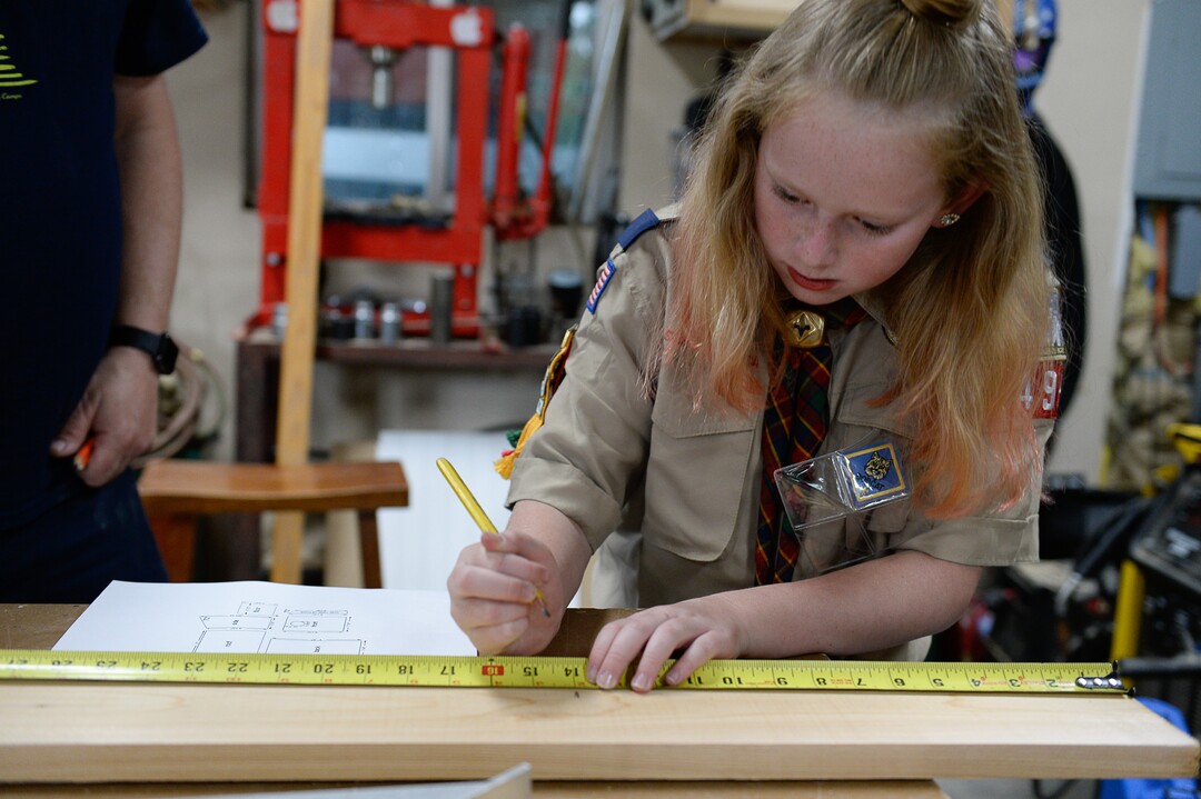 (Francisco Kjolseth  |  The Salt Lake Tribune)  Miriam Cook, 11, an early adopter into Cub Scouts spends time helping her older brother with his Eagle Scout project in the family garage in Tooele, Monday, May 14, 2018. Currently in Webelos, Miriam has a goal of getting her Arrow of Light, the bridge from Cub Scouts to Boy Scouts (which will be called Scouts BSA after February).