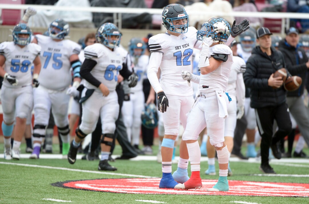 (Leah Hogsten  |  The Salt Lake Tribune) Sky ViewÕs Mason Falslev and Kason Carlsen celebrate play. Sky View High School defeated Park City 35-0 to win the 4A State Championship football title, Nov. 11, 2019 at Rice-Eccles Stadium.