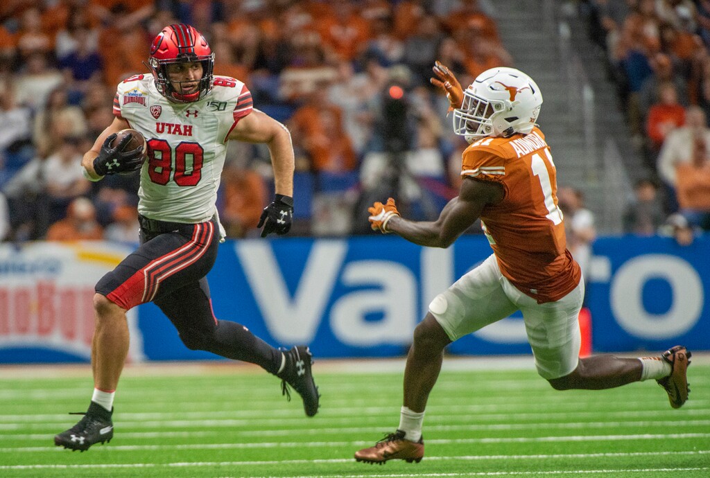 (Rick Egan  |  The Salt Lake Tribune)   Utah tight end Brant Kuithe (80) gets past Texas Longhorns defensive back Chris Adimora (11) in Alamo Bowl football action, between the Utes and the Texas Longhorns, in San Antonio, Tuesday, Dec. 31, 2019.. Kuithe, one of the Utes' top playmakers, will return for the 2021 season.