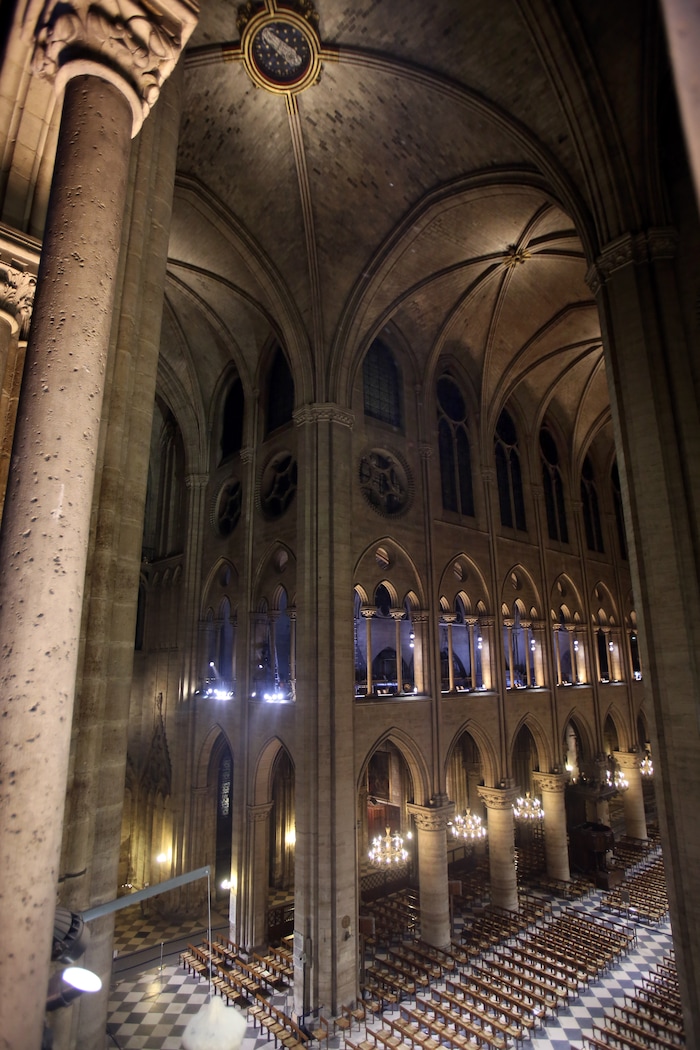 View of Notre Dame Cathedral in Paris with its new interior lighting presented Tuesday March 11, 2014. The new lighting design at the Notre-Dame cathedral is made of lead fixtures to highlight the XIIth century monument. Around 14 million people visit the Cathedral each year. (AP Photo / Remy de la Mauviniere)  