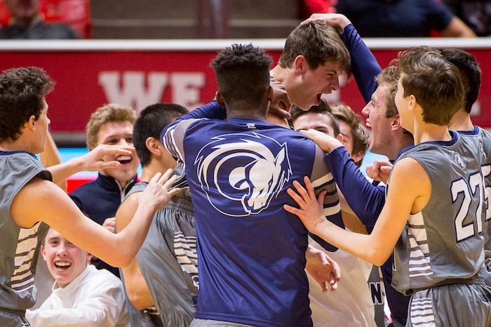 (Trent Nelson | The Salt Lake Tribune)  Box Elder vs. Corner Canyon, 5A State high school basketball tournament at the Huntsman Center in Salt Lake City, Wednesday Feb. 28, 2018. Corner Canyon players surround Corner Canyon's Andrew Heath (45) at the end of the game.