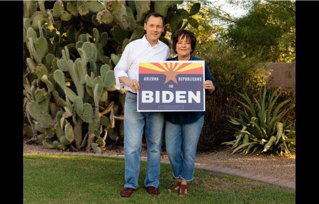 (Cassidy Araiza | The New York Times) Dan and Nan Barker, members of the Church of Jesus Christ of Latter-day Saints who remain Republicans but do not support President Donald Trump, with the Arizona Republicans for Biden campaign yard sign that they created, at their home in Gilbert, Ariz., Sept. 7, 2020. Loyalty to the Republican Party is ingrained in the Latter-day Saints religion, but in Arizona, some find the president's behavior at odds with their values, and are shifting to Joe Biden.