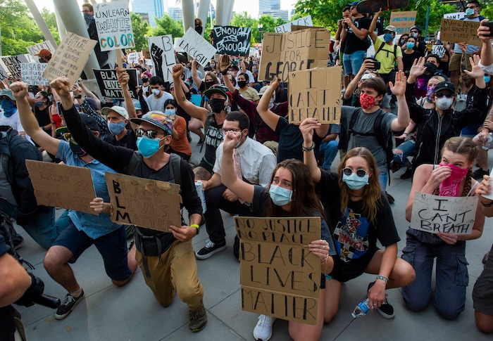 (Rick Egan  |  The Salt Lake Tribune)     Protesters urge the police to kneel with them at the Public Safety Building in Salt Lake City, Monday, June 1, 2020.