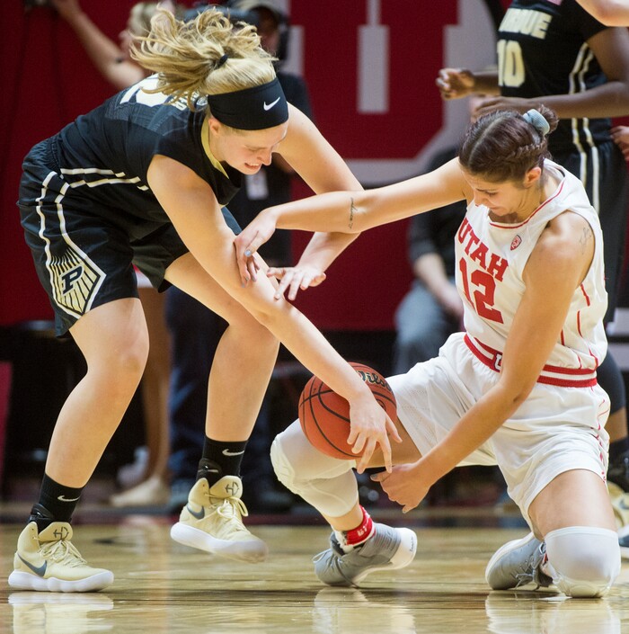 (Rick Egan  |  The Salt Lake Tribune)  Utah Utes forward Emily Potter (12) goes for the ball along with Purdue Boilermakers center Nora Kiesler (12), in basketball action Utah Utes vs. Purdue Boilermakers, at the Jon M. Huntsman Center, Monday, Nov. 20, 2017.