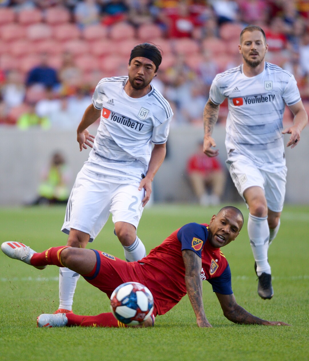 (Leah Hogsten  |  The Salt Lake Tribune) Real Salt Lake midfielder Everton Luiz (25) hits the pitch while racing Los Angeles FC midfielder Lee Nguyen (24) to the ball as Real Salt Lake hosts Los Angeles Football Club in the fourth round of the Lamar Hunt U.S. Open Cup, June 11, 2019 at Rio Tinto Stadium in Sandy.
