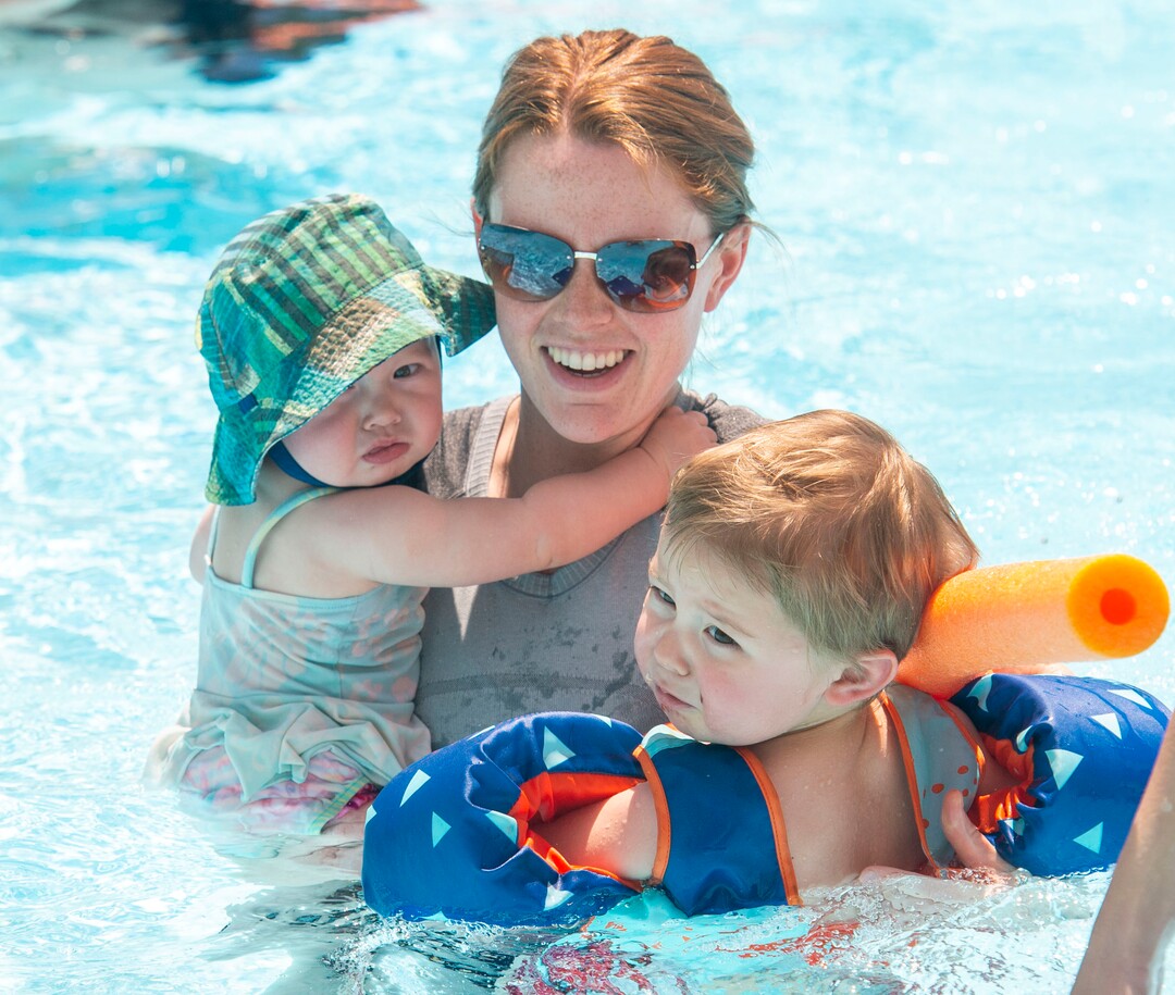 (Rick Egan  |  The Salt Lake Tribune)    Kaitlyn Curtis swims with Ada and Theo at the Jewish Community Center, May 31, 2019