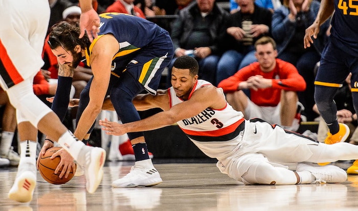 (Trent Nelson | The Salt Lake Tribune)  Portland Trail Blazers guard CJ McCollum (3) reaches in and fouls Utah Jazz guard Ricky Rubio (3) as the Utah Jazz host the Portland Trail Blazers, NBA basketball in Salt Lake City, Wednesday November 1, 2017.