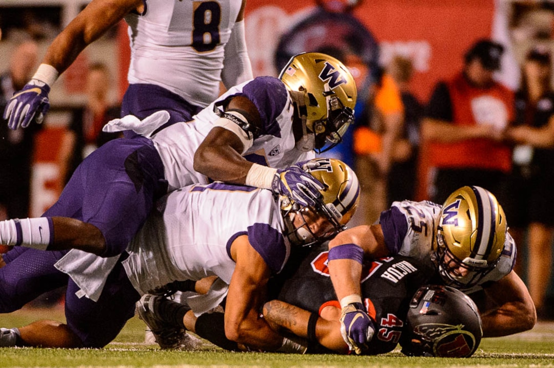 (Trent Nelson | The Salt Lake Tribune)  Utah Utes wide receiver Samson Nacua (45) is tackled as the University of Utah hosts Washington at Rice-Eccles Stadium in Salt Lake City, Saturday Sept. 15, 2018.