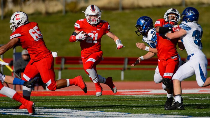 (Trent Nelson | The Salt Lake Tribune)
East's Charlie Vincent (21) runs the ball as East hosts Pleasant Grove in the first round of the 6A high school football playoffs, Friday Oct. 26, 2018.