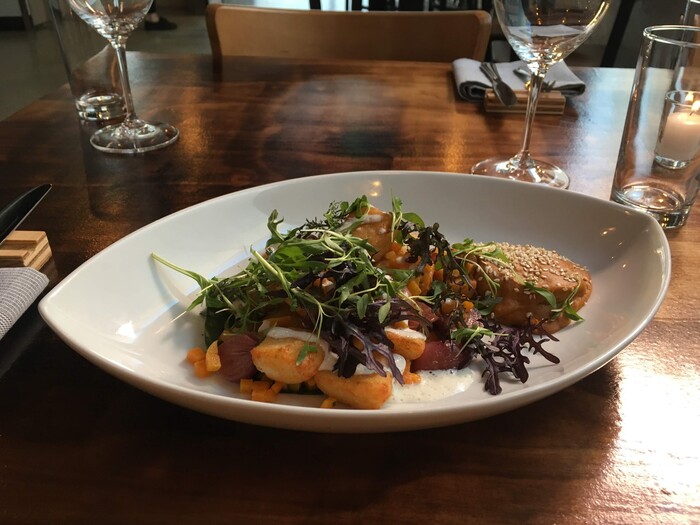 (Photo courtesy of SLC Eatery) Tamolitos with pumpkin mole and Mexican crema at SLC Eatery.