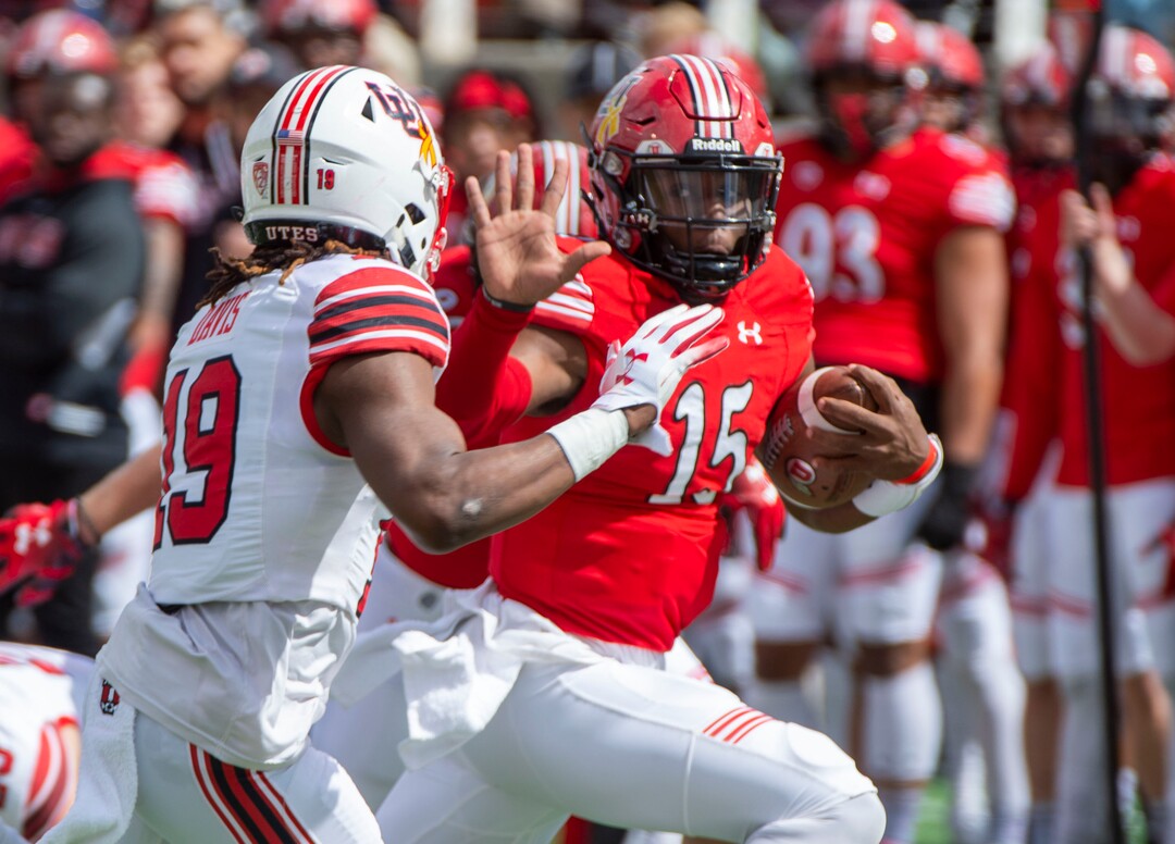 (Rick Egan  |  The Salt Lake Tribune)  Quarterback Jason Shelly (15) gets past Defensive back Vonte Davis, as on a quarterback keeper, in Utah's annual Read and White game at Rice-Eccles Stadium,Saturday, April 13, 2019.