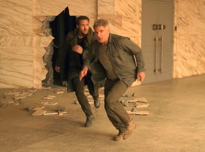 This image released by Warner Bros. Pictures shows Ryan Gosling, left, and Harrison Ford in a scene from "Blade Runner 2049." The Utah Film Critics Association gave the movie two awards — for Roger Deakins' cinematogaphy, and for the adapted screenplay by Hampton Fancher and Michael Green — in a meeting Dec. 17, 2017. (Stephen Vaughan/Warner Bros. Pictures via AP)