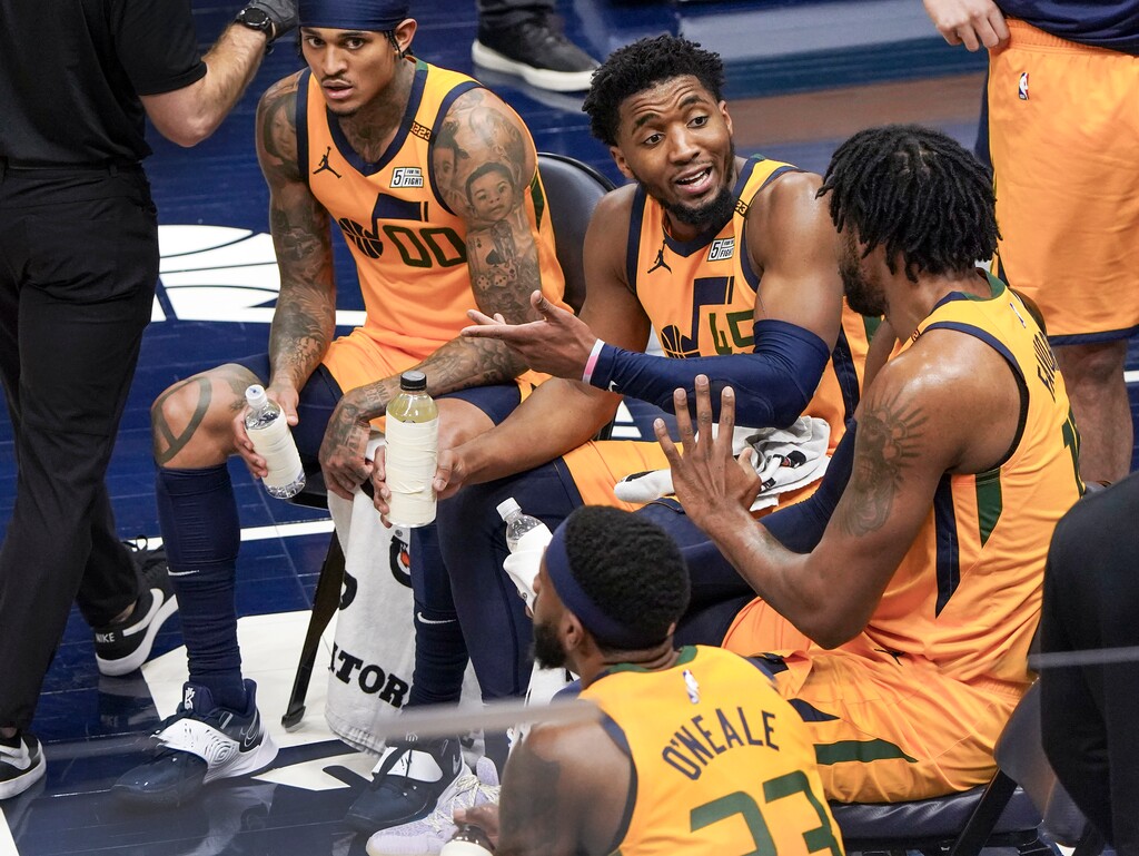 (Leah Hogsten | The Salt Lake Tribune) Utah Jazz guard Donovan Mitchell (45) and Utah Jazz center Derrick Favors (15) talk play during a timeout as the Utah Jazz host the Memphis Grizzlies, Mar. 27, 2021 at Vivint Arena. 