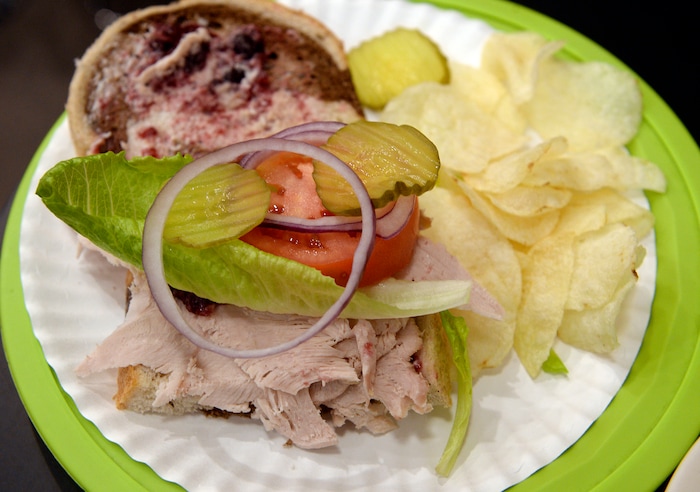 (Al Hartmann  |  The Salt Lake Tribune) A turkey sandwich with cranberry, mayo, horseradish and veggies, a longstanding favorite at Uptown Fare in Park City.  A turkey is roasted every day of the week.
