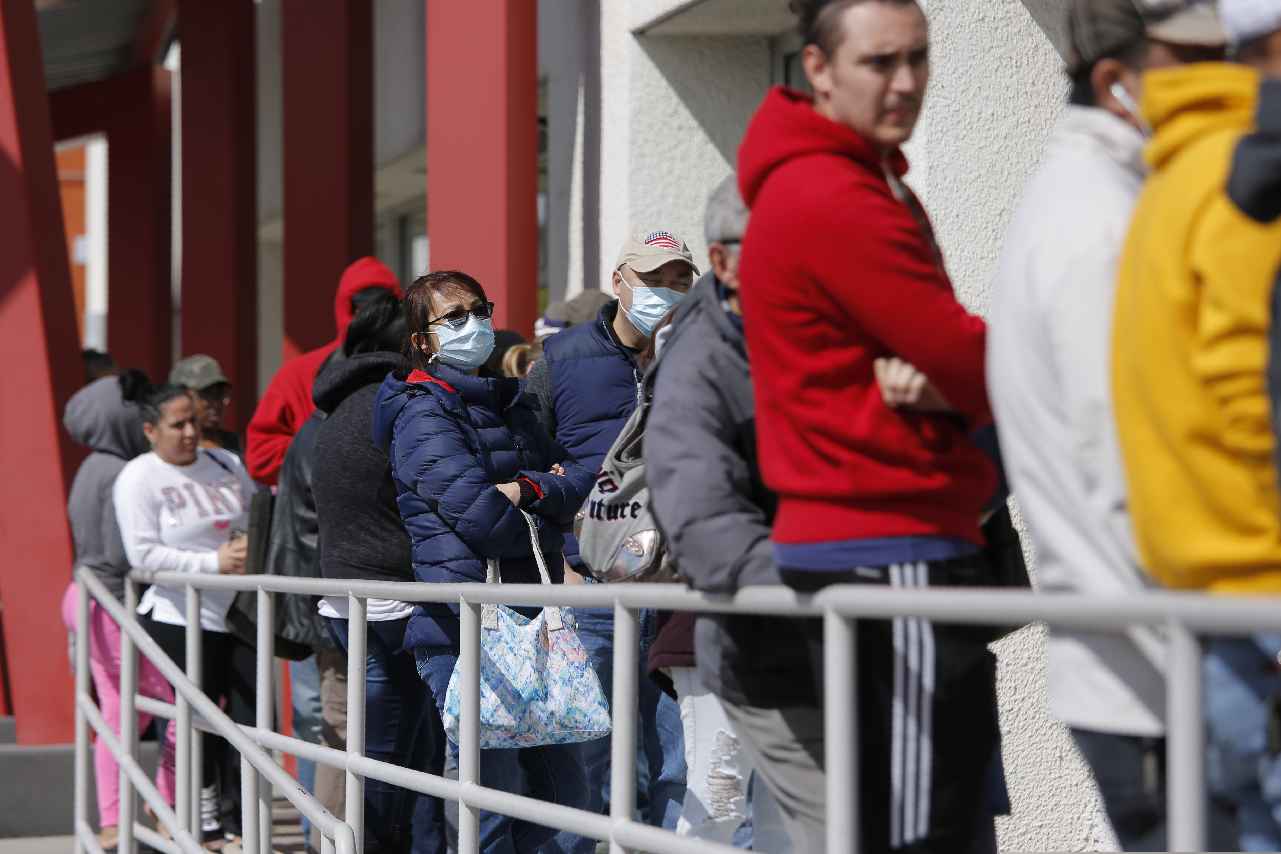 (John Locher | AP file photo)  People wait in line for help with unemployment benefits at the One-Stop Career Center in Las Vegas on March 17, 2020.