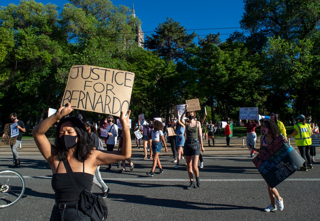 (Rick Egan  |  The Salt Lake Tribune) Marchers cut across the street to avoid the lines of Salt Lake City Police officers at each intersection during a Justice for Bernardo Palacios-Carbajal protest on Tuesday, June 23, 2020.