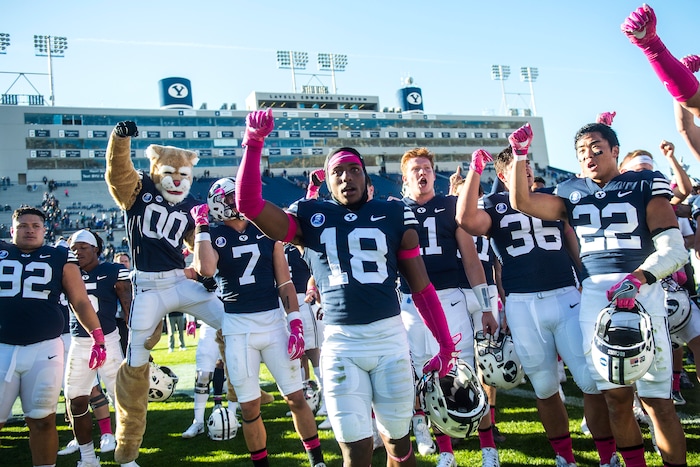 (Chris Detrick  |  The Salt Lake Tribune)  Brigham Young Cougars sing after the game at LaVell Edwards Stadium Saturday, October 28, 2017.  Brigham Young Cougars defeated San Jose State Spartan 41-20.