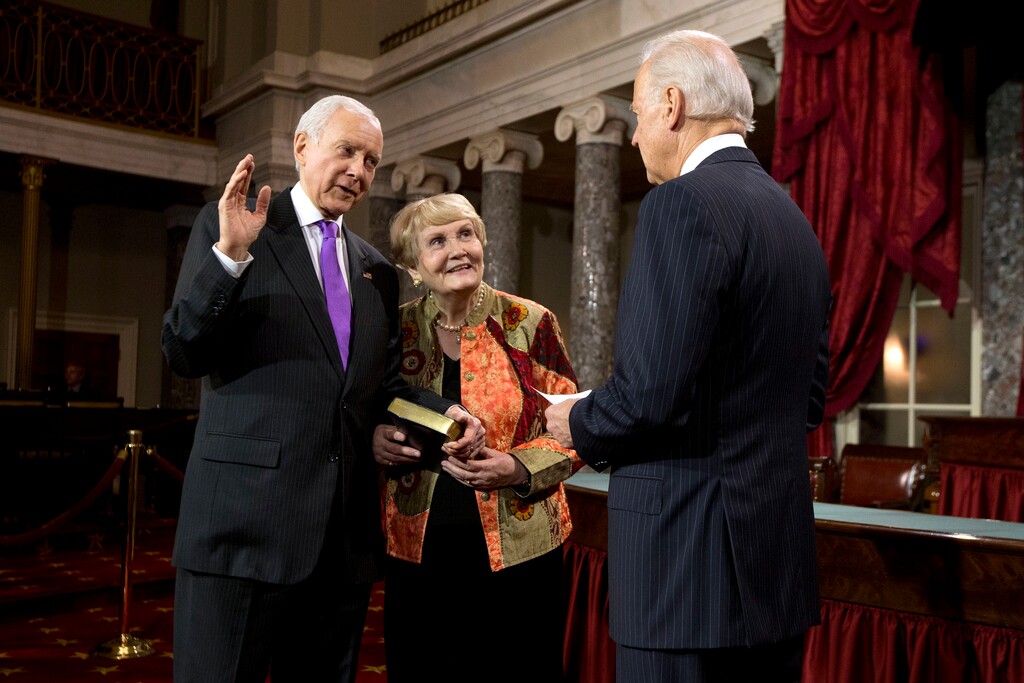 FILE - In this Jan. 3, 2013, file photo, Vice President Joe Biden administers the Senate Oath to Sen. Orrin Hatch, R-Utah, accompanied by his wife Elaine, during a mock swearing in ceremony on Capitol Hill in Washington, as the 113th Congress officially began. Hatch said he will not seek re-election after serving more than 40 years in the U.S. Senate. (AP Photo/ Evan Vucci, File)