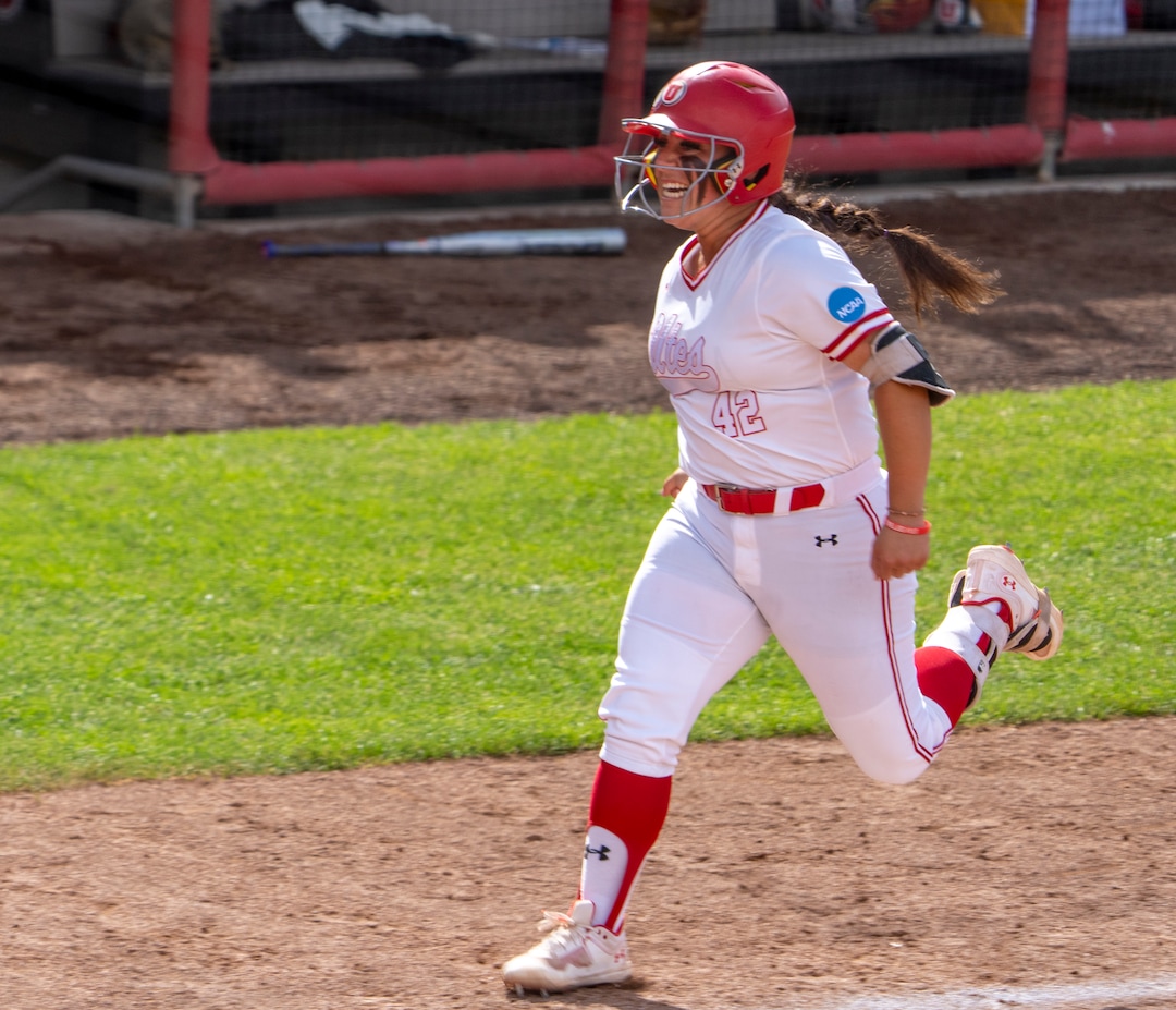 (Rick Egan | The Salt Lake Tribune)  Julia Jimenez is all smiles as she rounds the bases after hitting a grand slam home run, giving Utah a 7-1 lead, in NCAA Softball Super Regionals action between the Utah Utes and the San Diego State Aztecs, on Saturday, May 27, 2023.