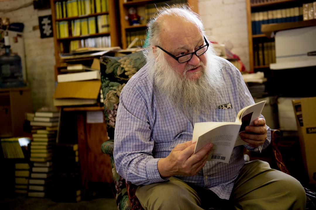 (Jeremy Harmon  |  The Salt Lake Tribune) Ken Sanders reads a poem from Kenneth W. Brewers' book Whale Song at Ken Sanders Rare Books in Salt Lake City on January 16, 2020.