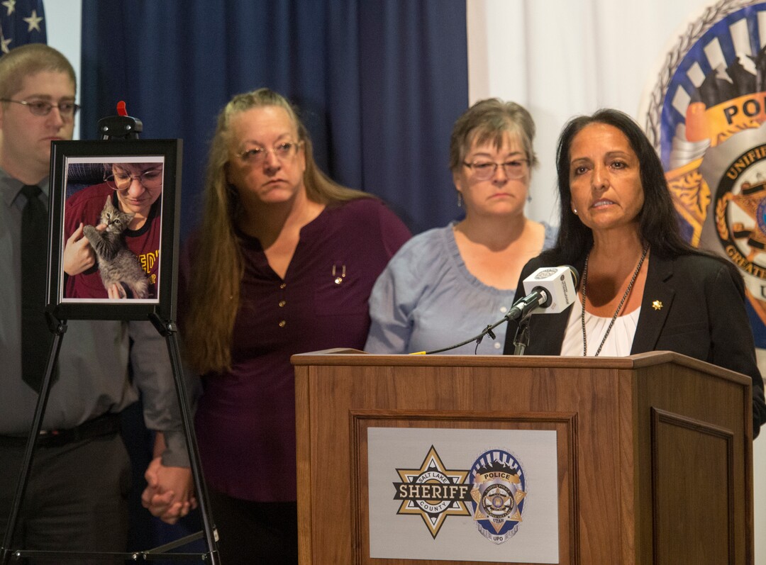 (Rick Egan  |  The Salt Lake Tribune)  Salt Lake County Sheriff Rosie Rivera, center, talks about the beating death of Valerie Sue Brantzeg (shown in the picture frame), accompanied by Brantzeg's relatives, at the Salt Lake County Sheriff's Office, Friday, Sept. 7, 2018. Formal charges have been filed against Walter Eugene Brantzeg, Valerie's estranged husband, in her death.