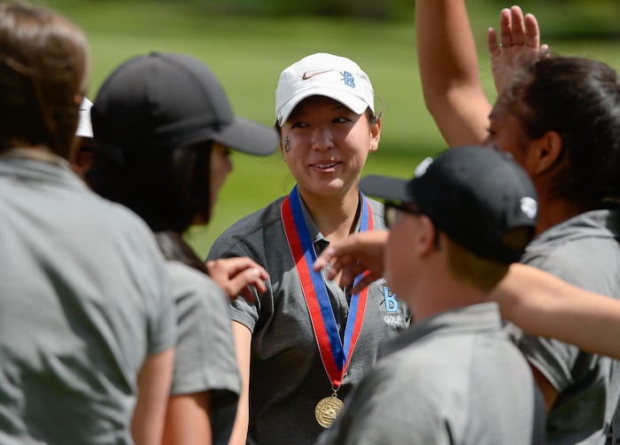 (Francisco Kjolseth  |  The Salt Lake Tribune)  Tess Blair is surrounded by Bingham teammates after taking the individual title by one stroke over Lone Peak on day two of the Class 6A girls' golf state tournament at Meadow Brook Golf Course in Taylorsville on Tuesday, May 15, 2018.