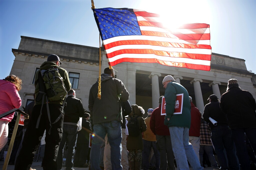 (Mel Evans | The Associated Press) A group of Second Amendment advocates gather in opposition to about a half-dozen gun control bills expected to get a vote in the Assembly on Monday, March 26, 2018, outside the War Memorial near the Statehouse in Trenton, N.J.