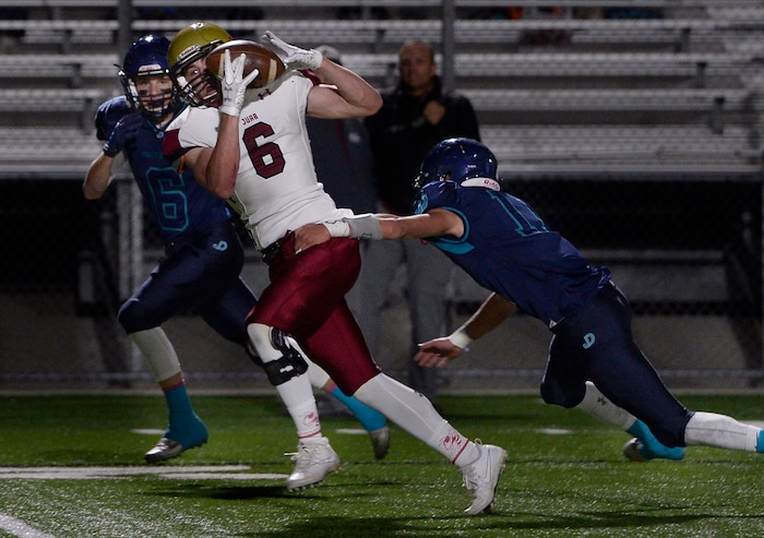 (Scott Sommerdorf   |  The Salt Lake Tribune)   Juab's Dallan West catches this pass during first half play as Juan Diego CB Dallen Davis attempts the tackle. Juan Diego beat Juab 33-28, Friday, October 6, 2017. 