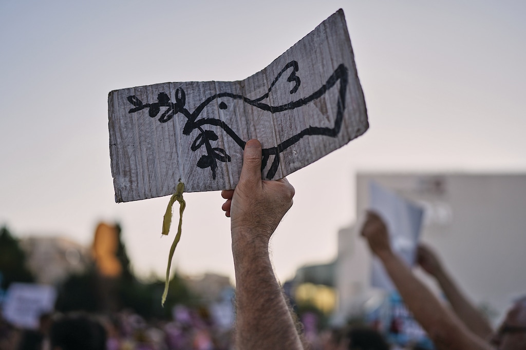 People demonstrate against Israeli settler violence in the occupied West Bank at Habima Square in Tel Aviv, Israel, Tuesday, July 28, 2026. (AP Photo/Oded Balilty)