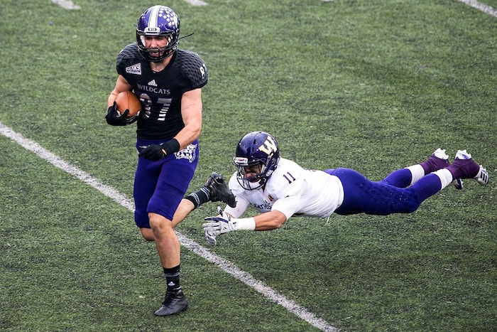(Chris Detrick  |  The Salt Lake Tribune)  Weber State Wildcats tight end Andrew Vollert (87) makes a one-handed catch past Western Illinois Leathernecks defensive back Eric Carrera (11) during the game at Stewart Stadium Saturday, November 25, 2017.  