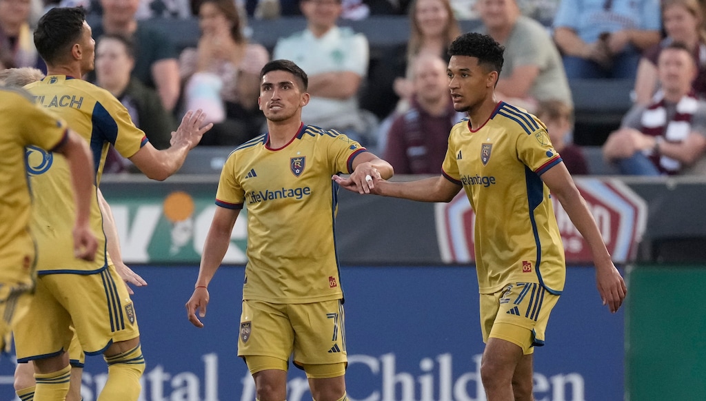 (David Zalubowski | AP) Real Salt Lake midfielder Pablo Ruiz, center, is congratulated after scoring a goal in the first half of an MLS soccer match against the Colorado Rapids, Saturday, May 20, 2023, in Commerce City, Colo.